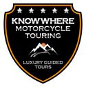 A black and white shield with the words knowhere motorcycle touring on it.